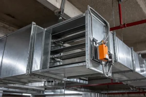 Industrial ceiling with air ducts and damper