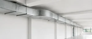 Clean rectangular ventilation ductwork in a commercial interior.